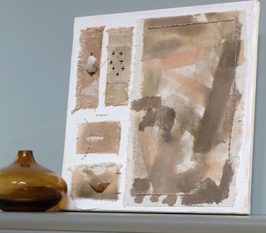 Abstract painting on canvas in earthy brown and beige tones, with textured fabric and soft brush strokes and natural agates