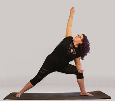 rachel in yoga pose, black outfit purple hair white background