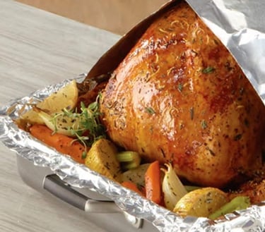 a turkey roasting turkey in foil