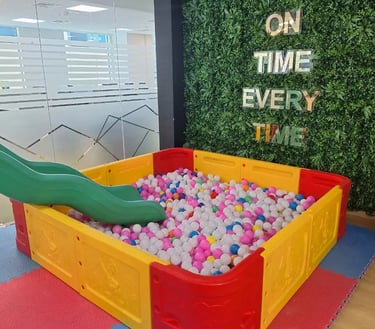 a play area with a slider and a slider in the middle of a