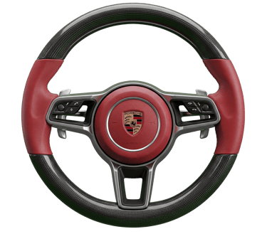 Custom Porsche steering wheel featuring red leather, carbon fiber trim, and multi-function controls.