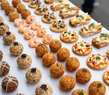 Close-up of colorful assorted sweets and savory snacks arranged on elegant platters.