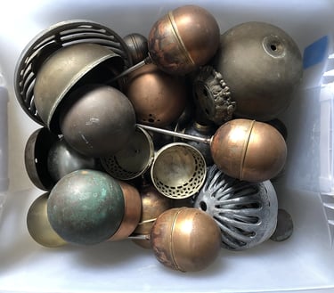 Metal parts in a sculptor's workshop bin, image 8.