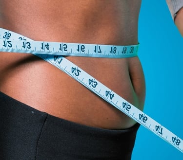 a woman's waist with a measuring tape measure tape around her waist