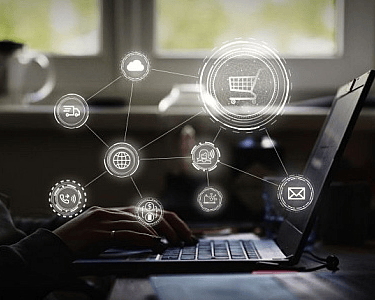 a person using a laptop computer with a lot of icons