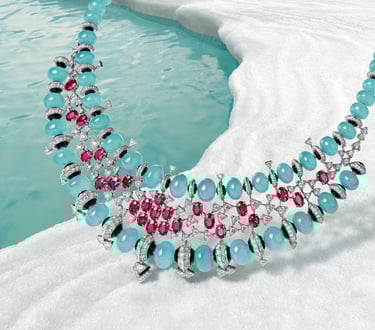 Luxury Cartier necklace featuring turquoise and ruby gemstones.