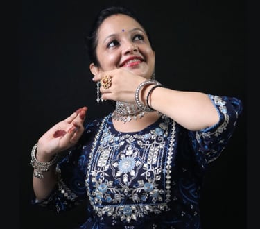 a woman demonstrating a graceful Kathak pose. Ms. Swati Sharma, Kathak Expert from Thirkan