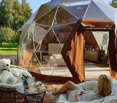 a woman sitting on a chair in a patio