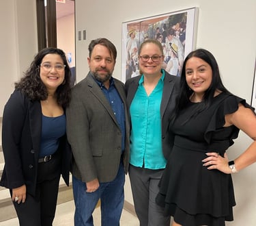 Dr. Hooton and Dr. Jason Pierce (center) with History Society leadership at their book launch event