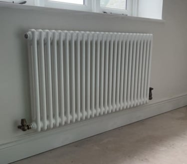 radiator on the wall thats been fixed by pbp services