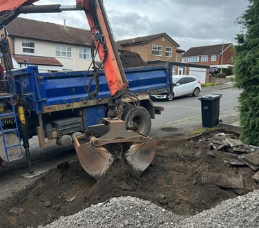 Grab lorry clearing soil from residential site in Birmingham