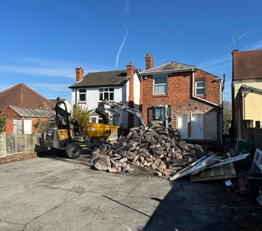Hydraulic breaker removing concrete in Birmingham