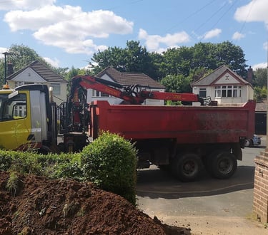 red grabber van outside a house on stourbridge