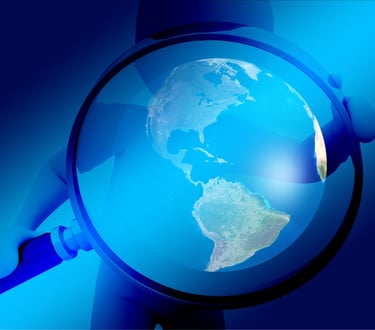 a magnifying image of a globe in the foreground