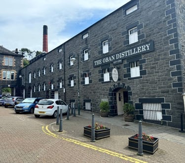 a brick building with cars parked in front