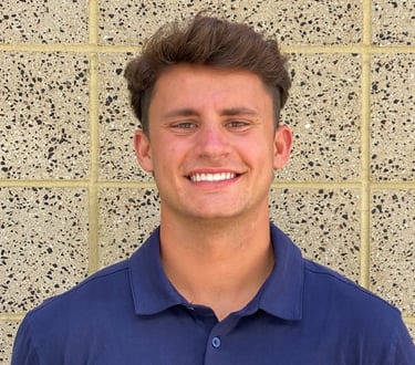 a man in a blue shirt and a banana peeler