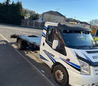 alt="Old vehicle ready for scrap pickup in Worcester driveway"
