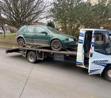alt="Scrap car being collected from driveway in Malvern Link"
