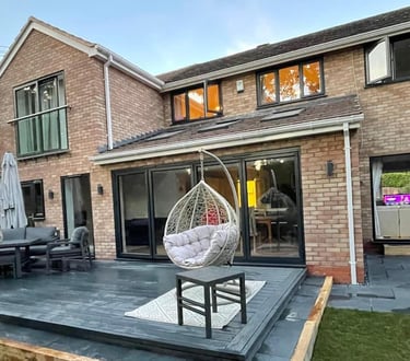Builders in Malvern constructing a modern home extension with patio doors