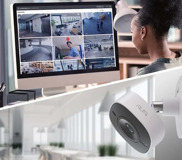 live video feeds from cloud-connected cameras using an advanced surveillance dashboard in a modern office setting.