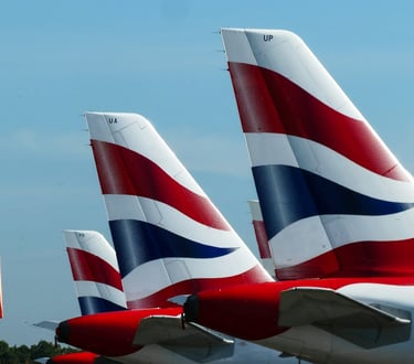 British Airways planes' tails visible in airport