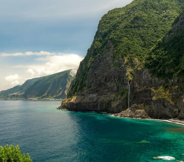 Green cliffs on Madeira Island above the Atlantic Ocean