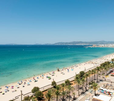 Sunlit sandy beach in Mallorca, Spain