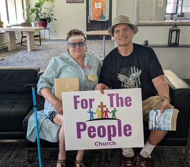 Brenda and Carl holding their bibles after an uplifting bible study.