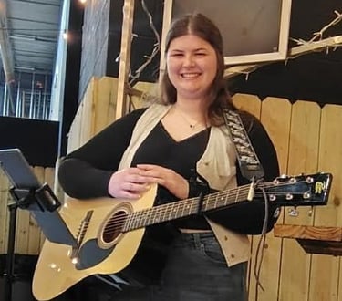 Kaleigh with her guitar