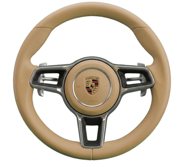 Beige leather Porsche steering wheel with silver trim and the official crest on a black background.