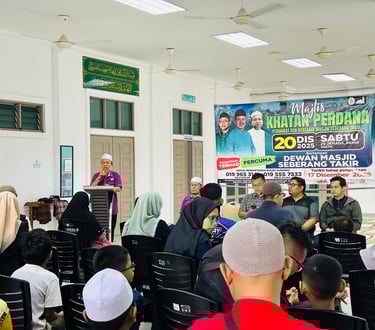 A community gathering at Dewan Masjid Seberang Takir for a Majlis Khatan Perdana circumcision event briefing.