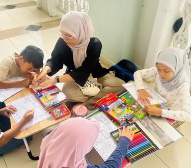 Children participating in a coloring contest with colored pencils and activity sheets.