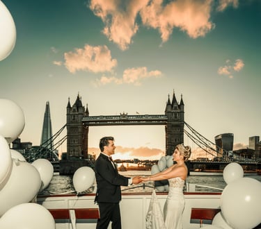 a bride and groom holding hands in front of Tower Bridge