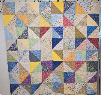 Memory quilt using women's dresses