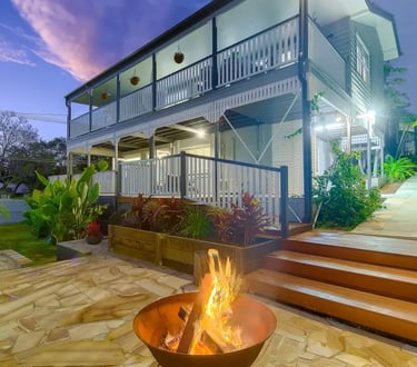 Finished Ashgrove Queenslander exterior repaint showing verandah and outdoor area