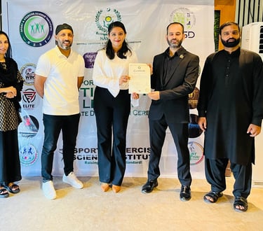 SESI Officials presenting a certificate of achievement to a female Personal trainer.