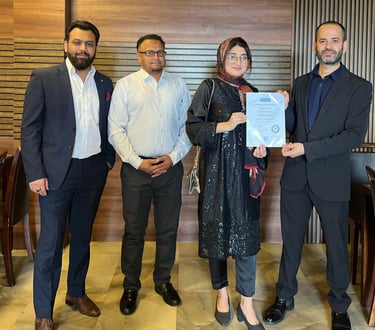 SESI Officials presenting a certificate of achievement to a female Personal trainer.