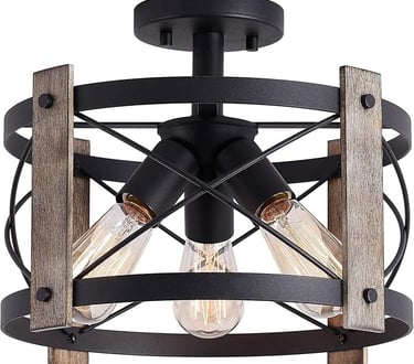 Matte black rustic flush mount ceiling light for warm living room ambiance.
