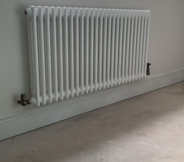 radiator on the wall thats been fixed by pbp services