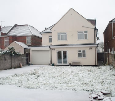 brick home extension with pitched roof in Evesham