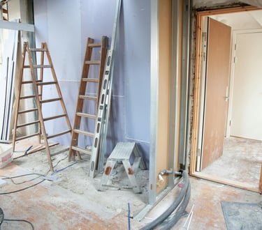 a room with ladders in being decorated in evesham