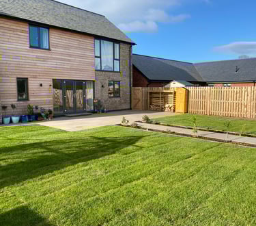 picture of house in malvern with back garden landscaped by Lakes building and plastering services