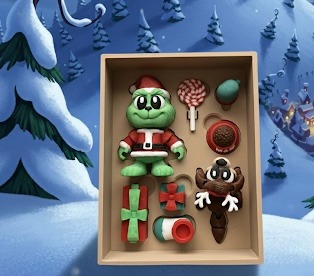 Christmas 'thief' book with Grinch, candy cane, max, presents, mitten and dog food bowl