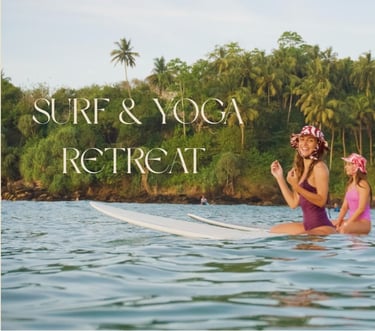girls sat on surfboards at tropical beach