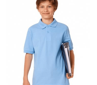 a boy in a blue shirt holding a tennis racket