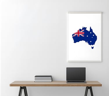 Desk with a laptop and map of Australia for learning English for relocation