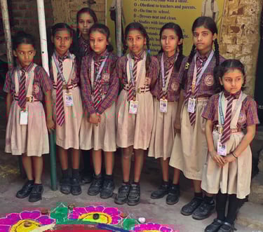Vishwa Bharati Shiksha Sadan students making Rangoli during Diwali celebrations.
