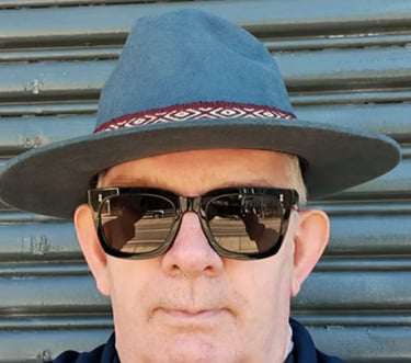 nick kemp wearing a hat and sunglasses