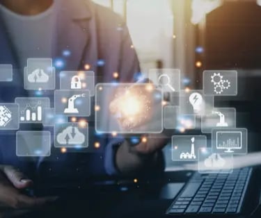 Professional interacting with a virtual dashboard featuring industrial automation and cloud computing icons.