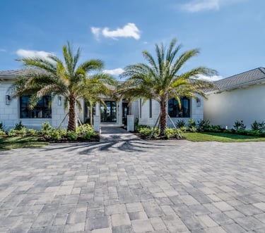 Florida home with palm tress in front